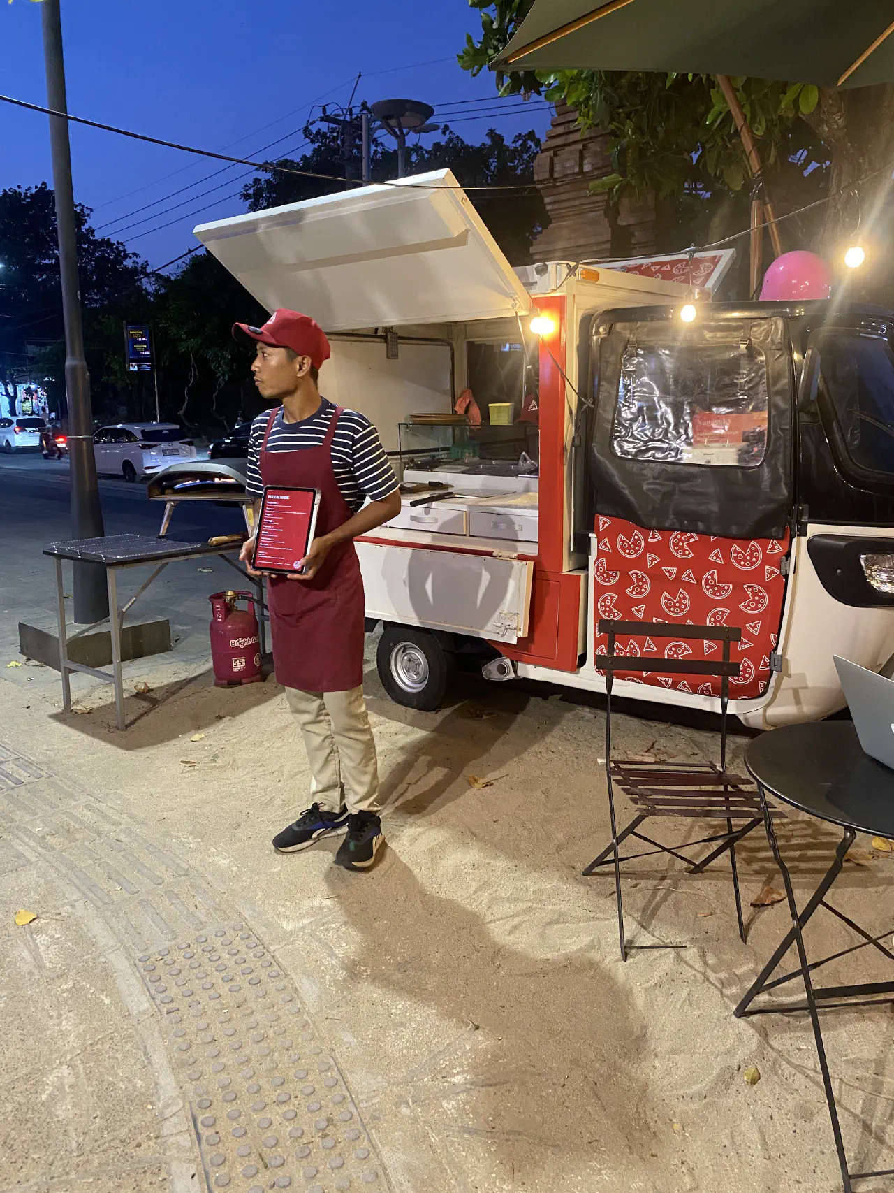 Anjas serving pizza at Kuta Beach