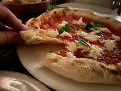 Crust close-up of pizza at Amici