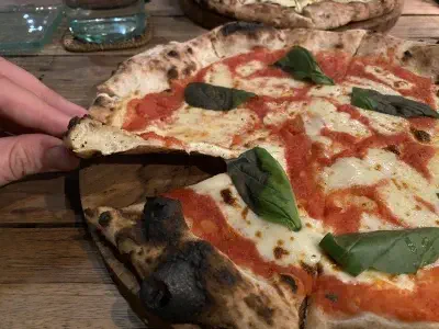 Crust close-up of pizza at Arte