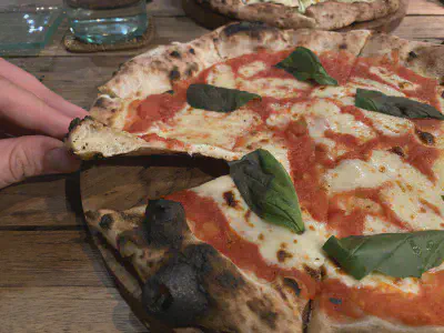 Crust close-up of pizza at Arte