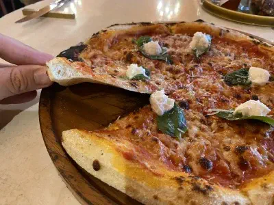 Crust close-up of pizza at Cantina Classe