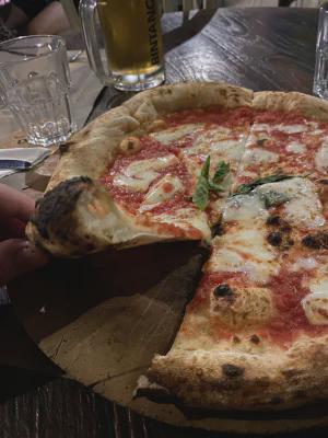 Crust close-up of pizza at L'Osteria