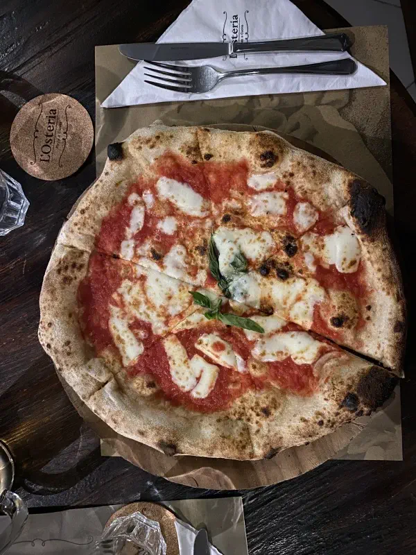 Top-down view of pizza at L'Osteria