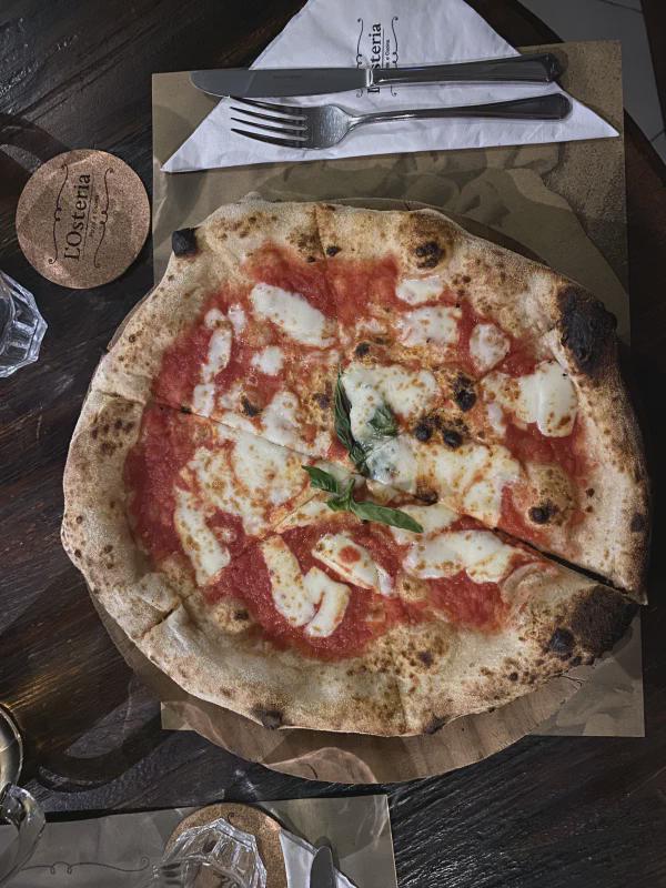 Top-down view of pizza at L'Osteria