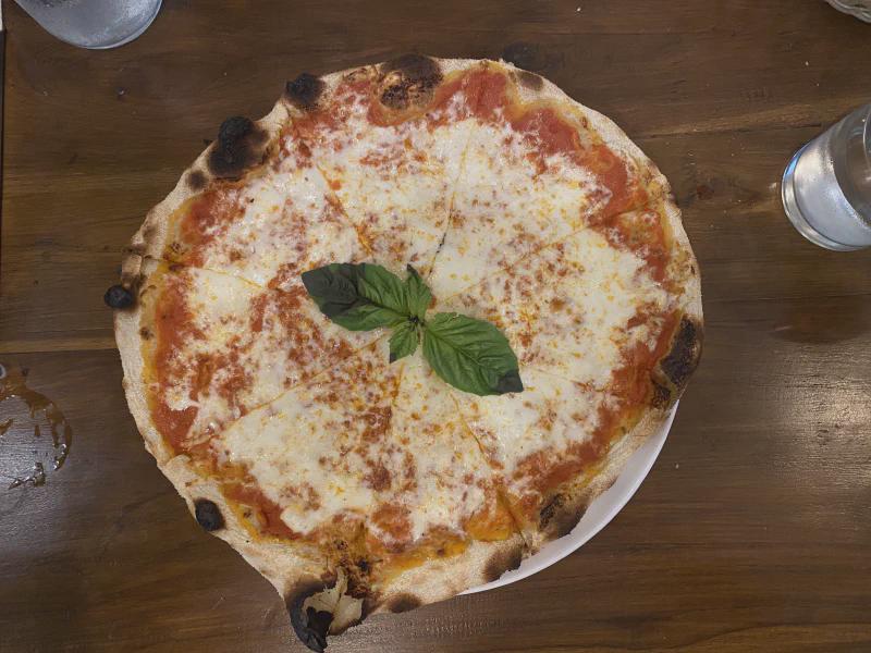 Top-down view of pizza at Via Emilia