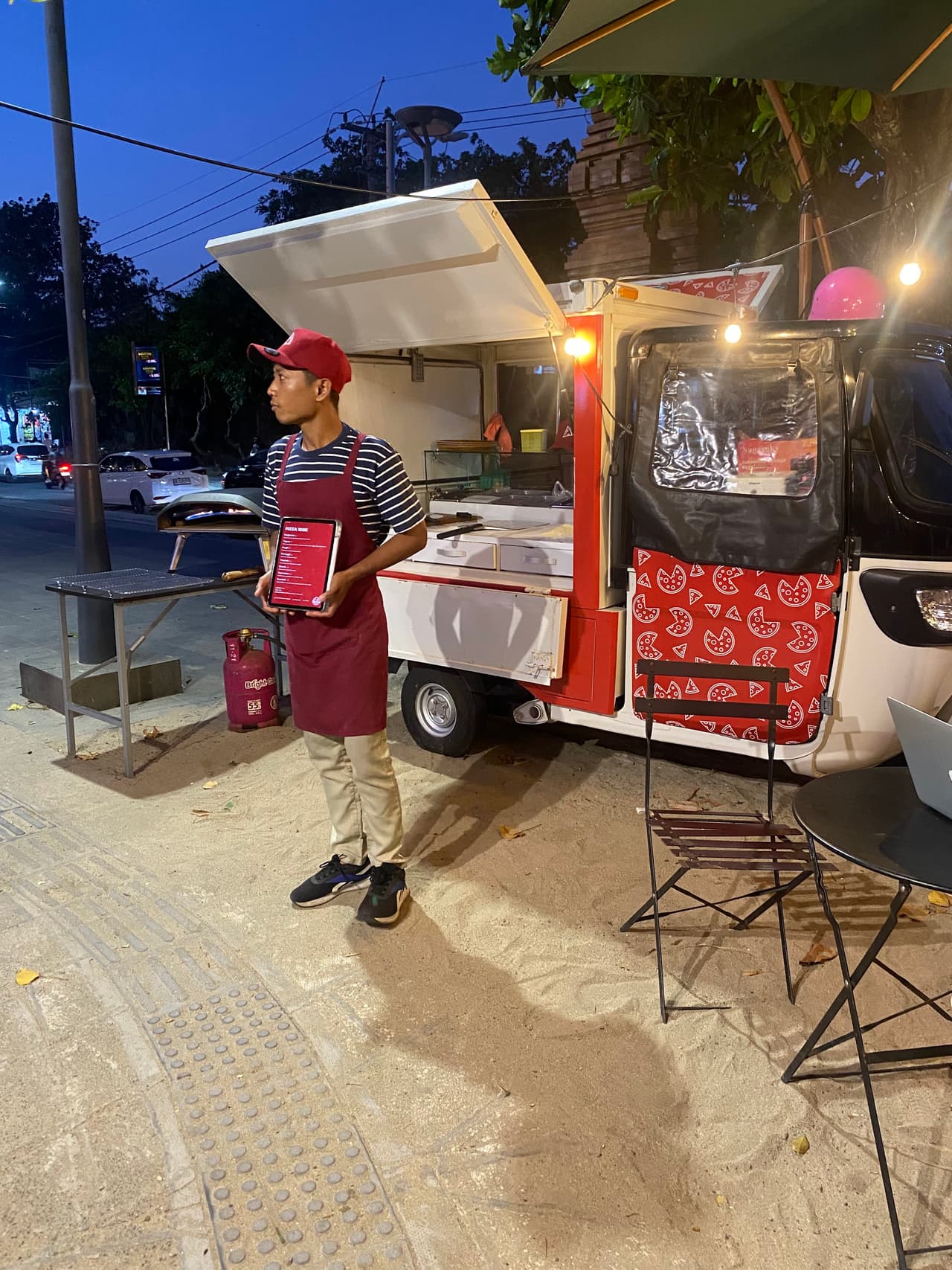 Anjas serving pizza at Kuta Beach