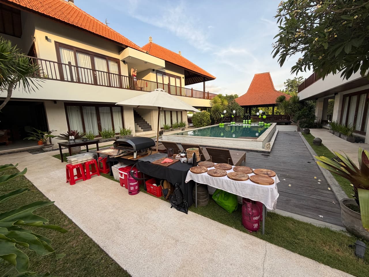 Our oven and serving tables set up beside a villa pool in Canggu