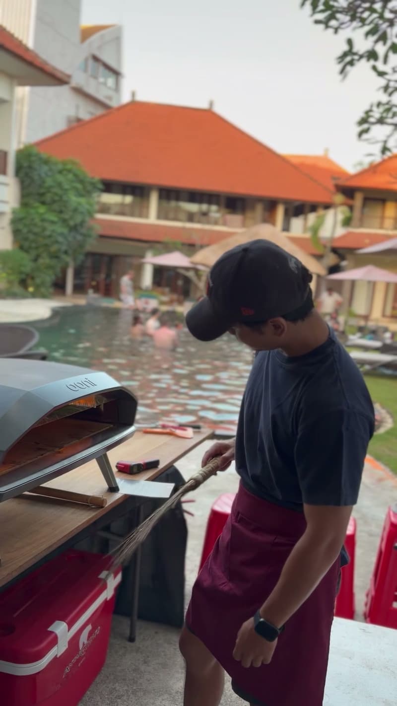 Cooking at the oven beside the pool at Villa Diana, Legian