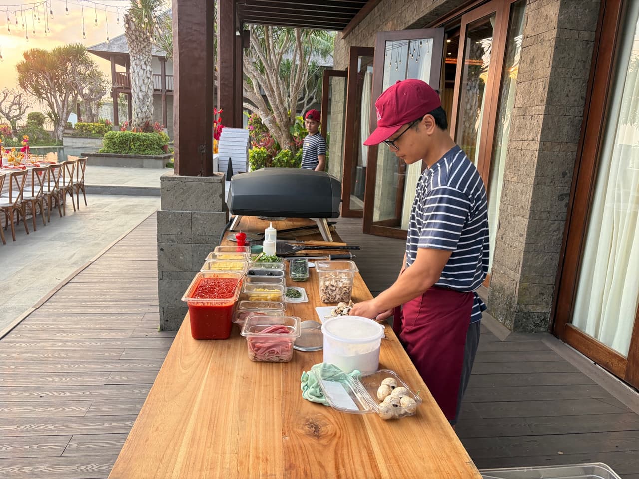 Setting out the toppings beside the oven at Stone Villas, Uluwatu