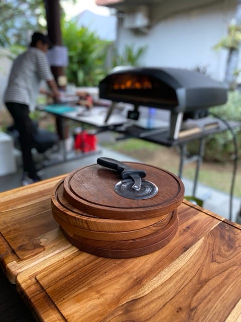 Pizza boards and ingredients ready for service